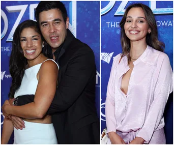 Group of people smiling at a "Frozen" event on the red carpet.