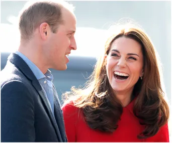I don't know who these individuals are, but a man and woman are smiling and laughing with sunlight behind them.