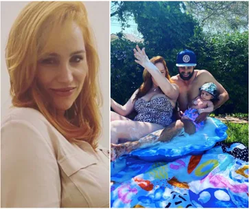 Woman smiling in portrait. Family with baby in swimsuit outdoors on inflatable in garden.