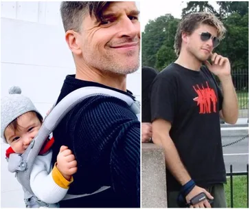 Father with baby in carrier smiling; beside, young man with sunglasses in a black t-shirt standing outdoors.