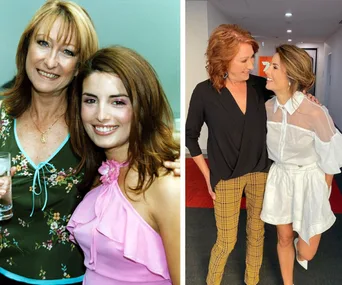 Two women in casual and elegant outfits, posing together and smiling warmly at one another.