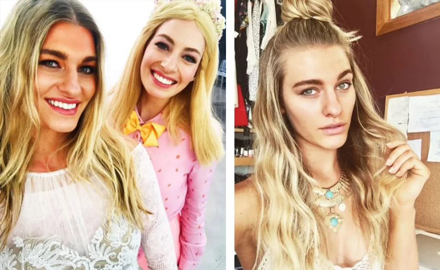 Two women with long blonde hair smiling. One wears pink with a yellow bow and crown; the other in lace, wavy hair styled up.