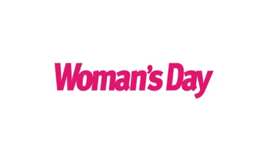 "Woman's Day logo in bold pink font on a white background."