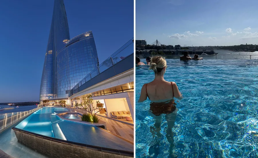 Exterior view of Crown Towers Sydney with night lighting; a woman stands in an infinity pool facing the harbor view.