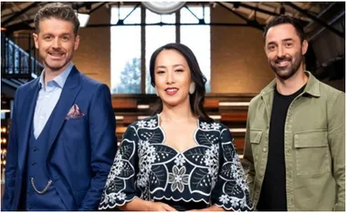Three MasterChef Australia judges standing together in a modern kitchen setting.
