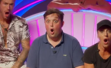 Three people sitting on a couch with surprised expressions on their faces against a neon backdrop.
