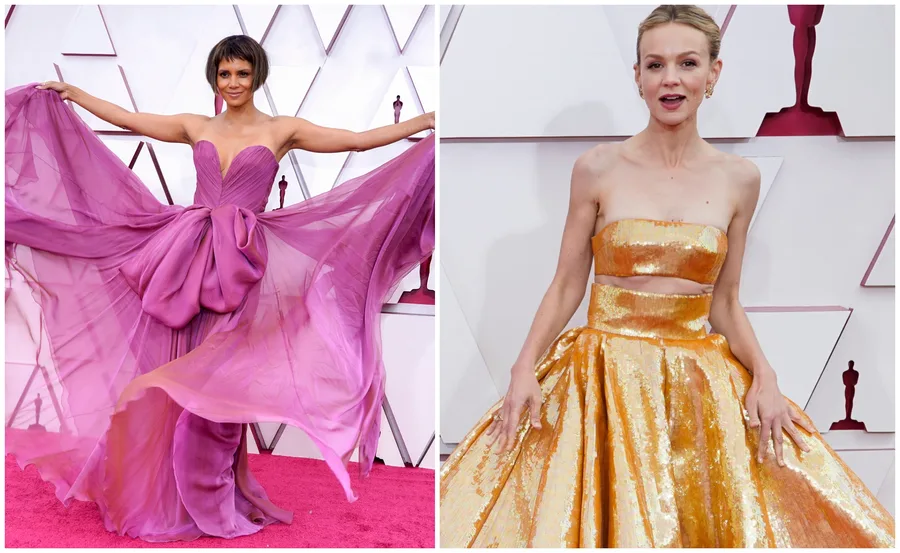 Two women on the Oscars 2021 red carpet: one in a flowing purple gown, the other in a shimmering gold dress.