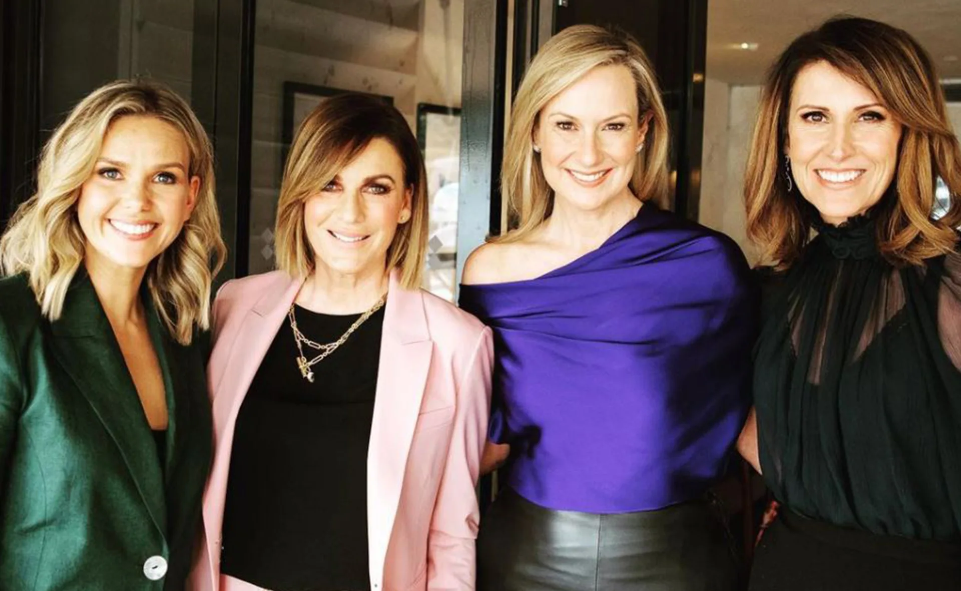 Women smiling and posing together, dressed in stylish outfits at a Channel 7 cast lunch event.