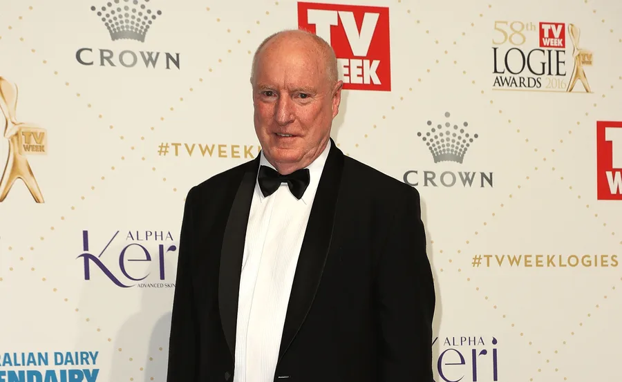 A man in a black tuxedo at the TV Week Logie Awards 2016, standing in front of a patterned backdrop.