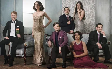 Cast of "Love on the Spectrum" Season 2, dressed in formal attire, sitting and standing in an elegant setting.
