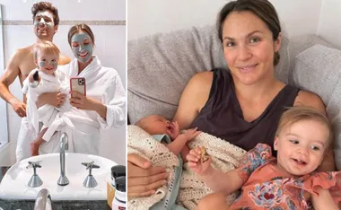 Family in bathrobes and face masks; a woman with two young children, one infant.