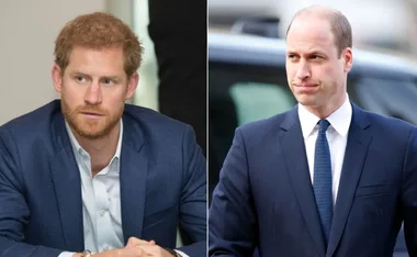 Two men in suits, one with reddish hair looking left, and the other with short dark hair, looking forward.