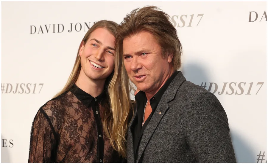 Two people smiling at an event with "#DJSS17" in the background.