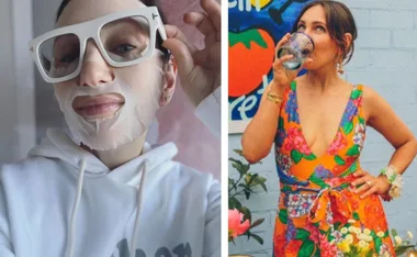 Woman wearing a sheet mask and sunglasses, another in a colorful floral dress sipping from a glass outside.