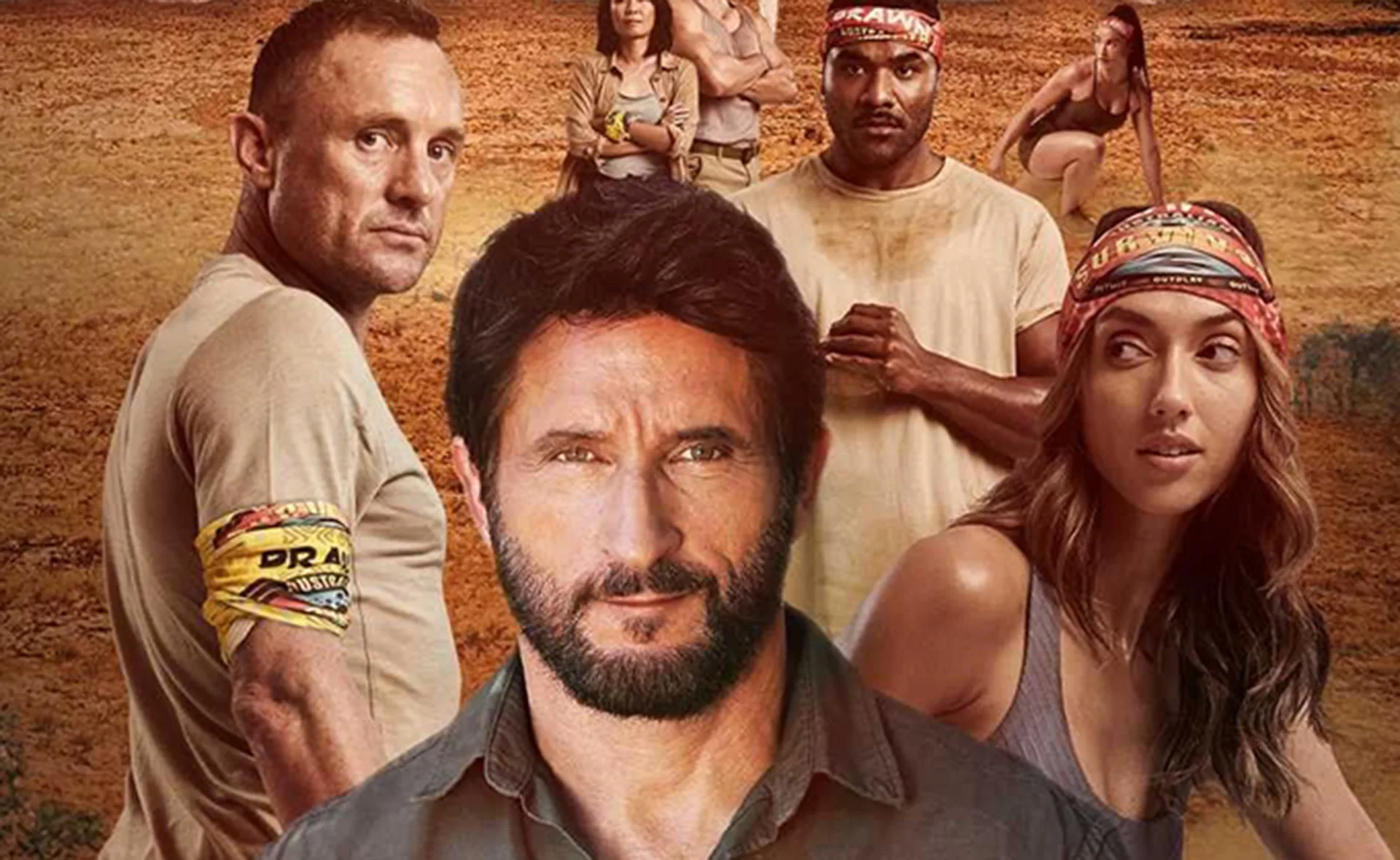 Cast members of Australian Survivor 2021 in a rugged outback setting wearing team buffs.