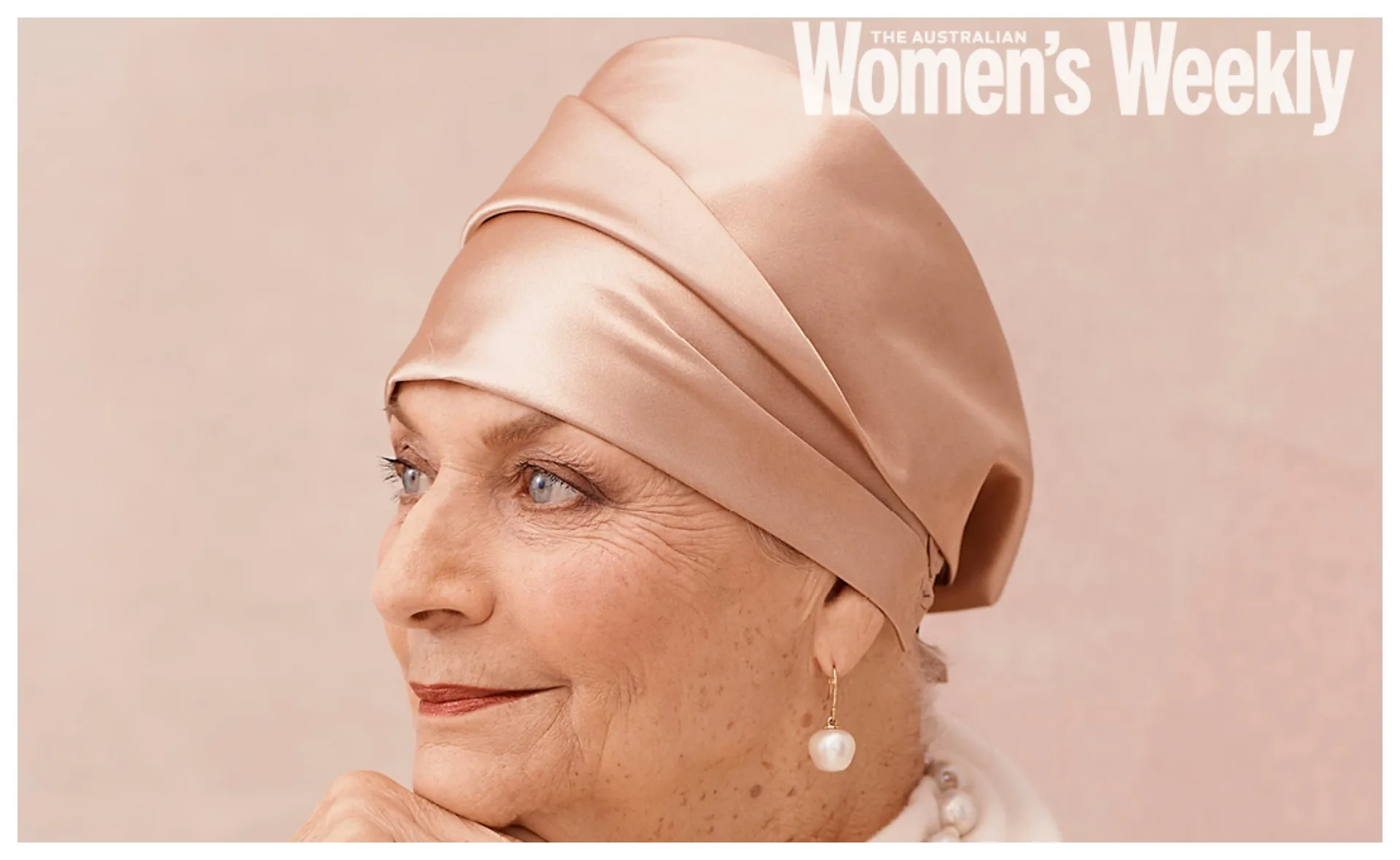Elderly woman wearing a silk headscarf and pearl earring, gazing slightly left, featured in Australian Women's Weekly.