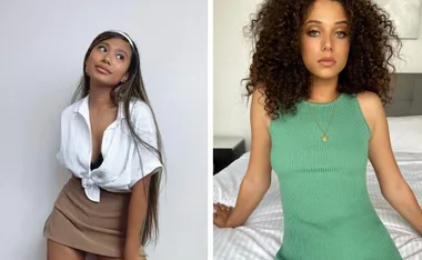 Two women posing; one wears a white shirt and brown skirt, the other a green dress with curly hair.