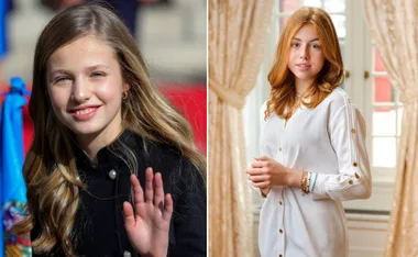 Princess in black waves, another in white stands by curtains, warm light fills the room.