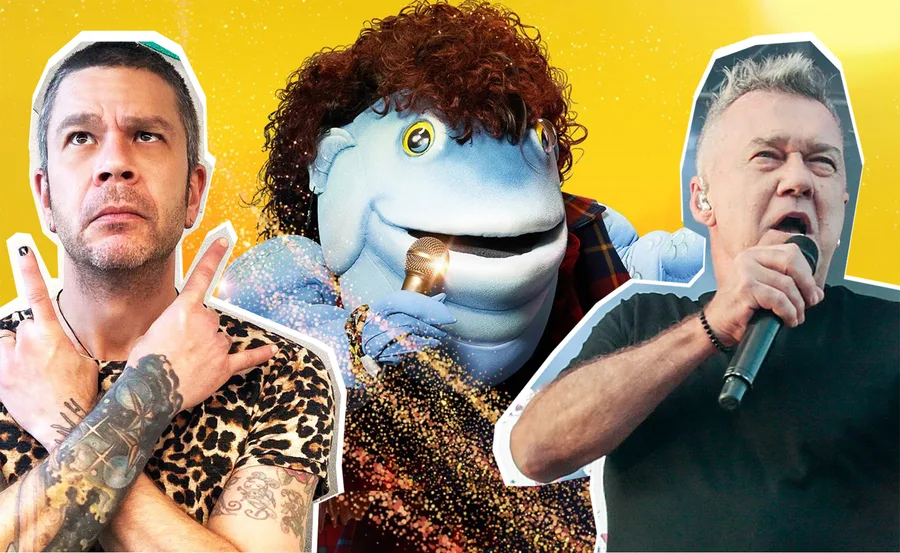 A blue puppet with curly hair sings into a microphone, flanked by two men, one crossing arms and one holding a mic.