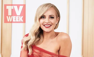 A woman in a red dress, smiling, with a "TV WEEK" logo in the background.