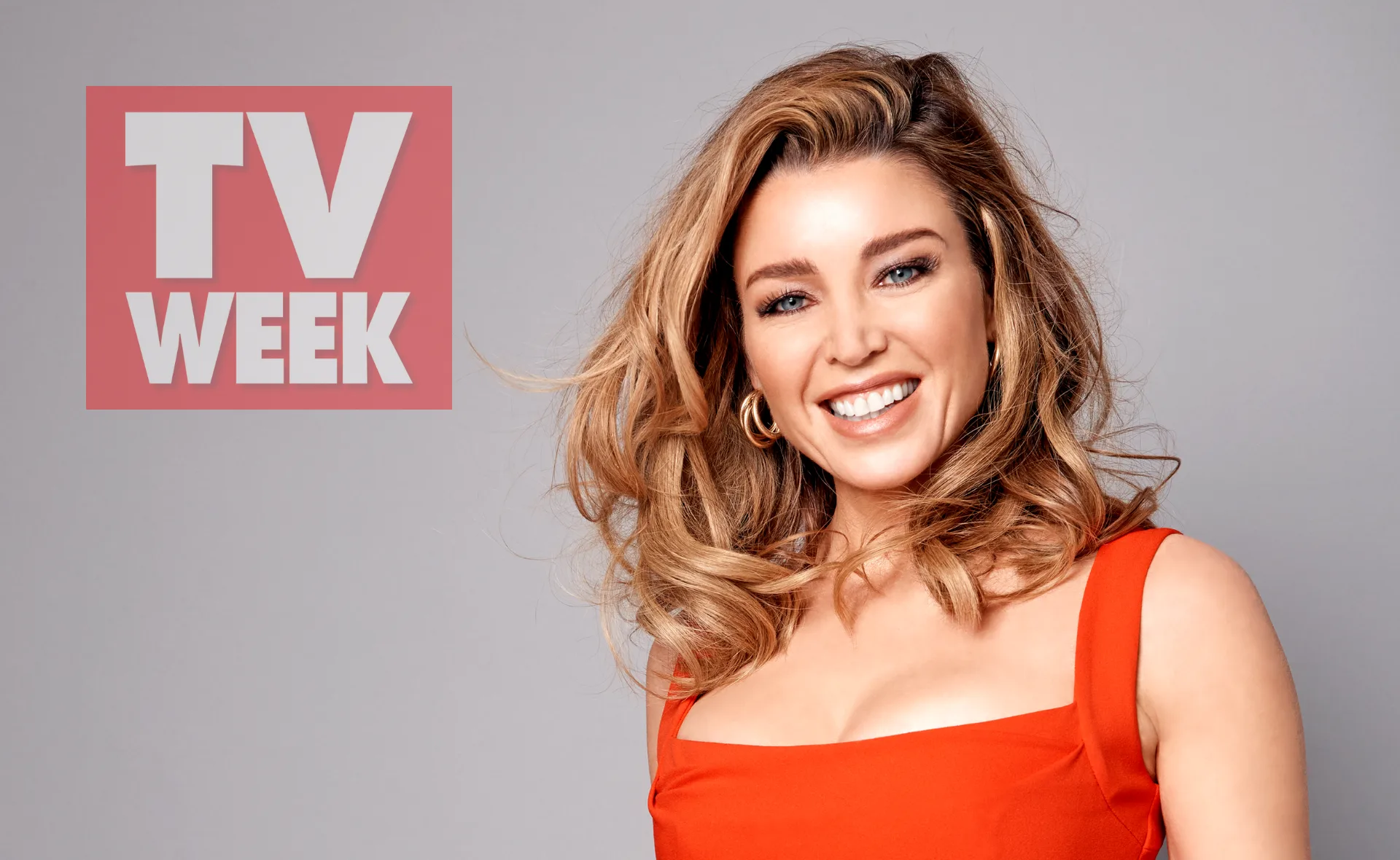 Smiling woman in a red dress with curly hair, next to a "TV WEEK" logo on a light background.