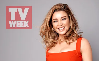 Smiling woman in a red dress with curly hair, next to a "TV WEEK" logo on a light background.