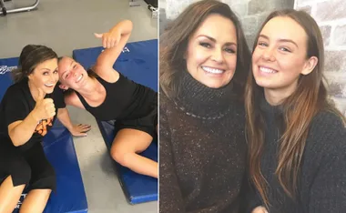 Two women smiling; one in workout attire giving a thumbs up, and the other in a sweater. They appear happy and relaxed.