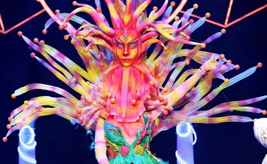 Colorful ocean-themed costume with vibrant tentacles and a vibrant headdress from "Masked Singer" performance.