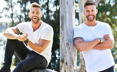 Man in a white T-shirt smiling outdoors; sitting and standing by a tree.