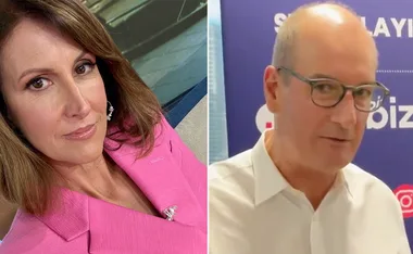 Two people side by side; a woman in pink and a man in glasses with a white shirt.
