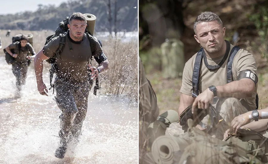 Man in military gear running through water and resting during outdoor training exercise.