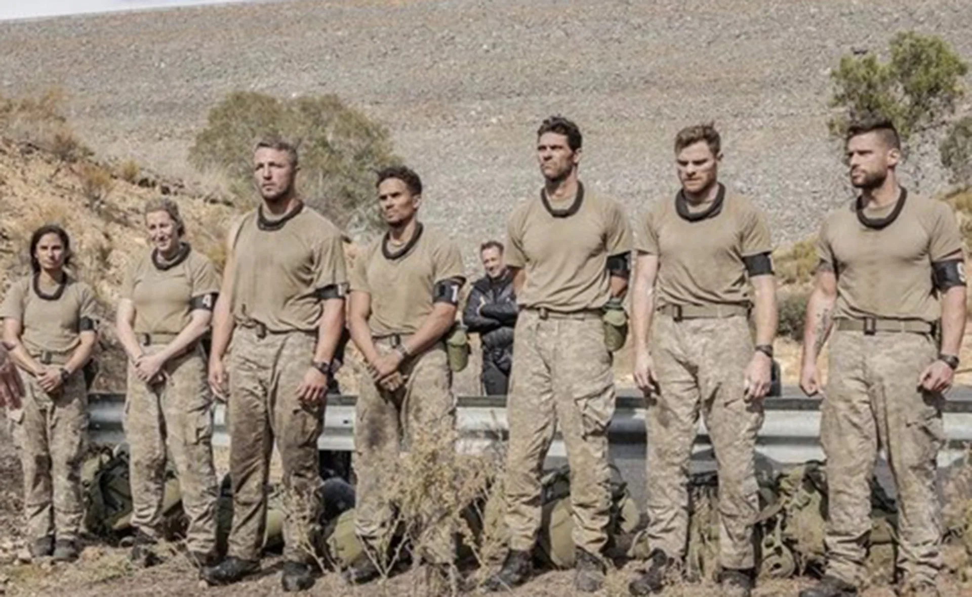 Group of contestants in uniform standing outdoors during a challenge on SAS Australia.
