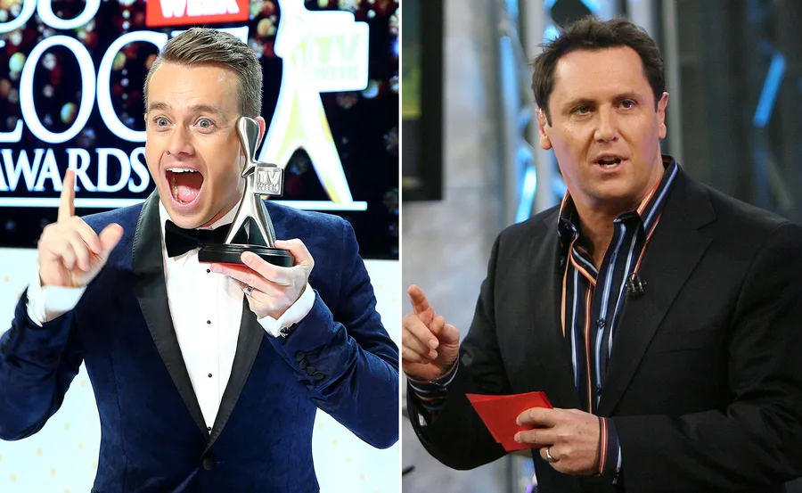 Two men in suits; one holding an award, the other speaking with a red card in hand.