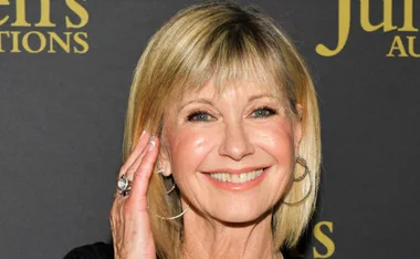 Olivia Newton-John gets her groove on as she reacts to a TikTok dance routine to her song Physical, but does the icon approve?