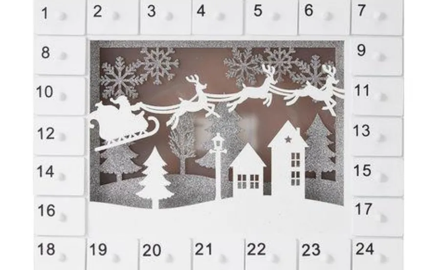 Advent calendar with Santa's sleigh and reindeer silhouette above snowy houses and trees, numbered boxes surround scene.