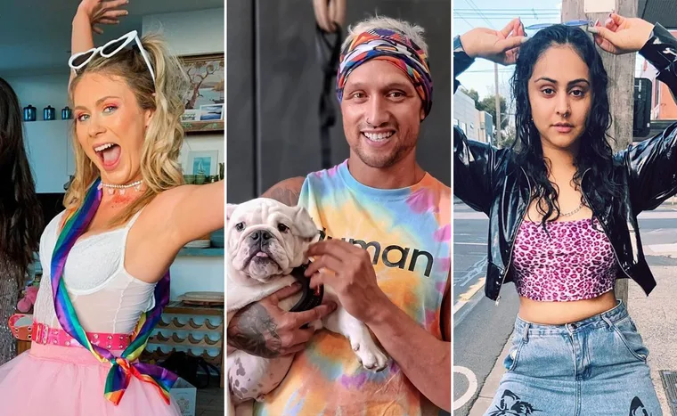 Three people; one with rainbow accessories, one holding a dog in tie-dye, and one with sunglasses on head in leopard top.