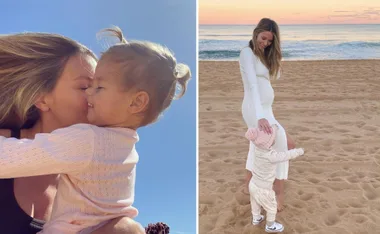 Woman kisses toddler in the sun; a beach scene with them walking at sunset.