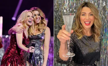 Women in sparkling dresses smile and hold a microphone and a drink, posing against a glittery backdrop.