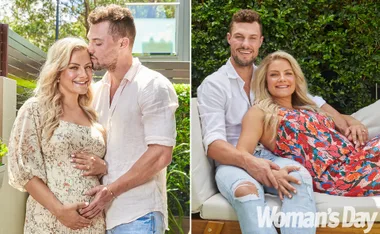 A couple embraces and poses outdoors, smiling in two different outfits. Woman cradles a baby bump.