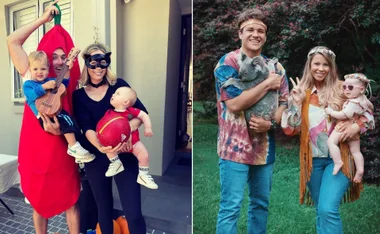 A family in festive costumes; left in a chili suit, right with a koala and peace sign, posing outdoors.