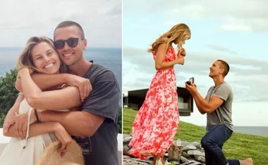 Man proposing to a woman on a grassy hill; couple hugging with an ocean view in the background.