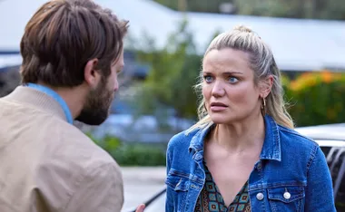 Two characters from "Home and Away" engaged in a tense conversation outdoors.