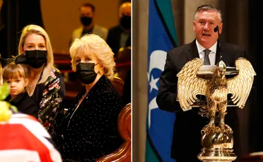 Two masked women and girl at funeral; man speaks at podium with eagle emblem.