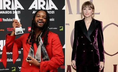Man in red suit holds ARIA Awards; woman in purple outfit stands on right.
