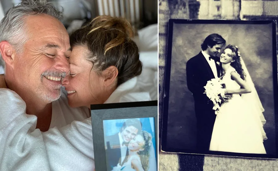 A couple embracing, holding a framed wedding photo next to a black and white wedding picture.