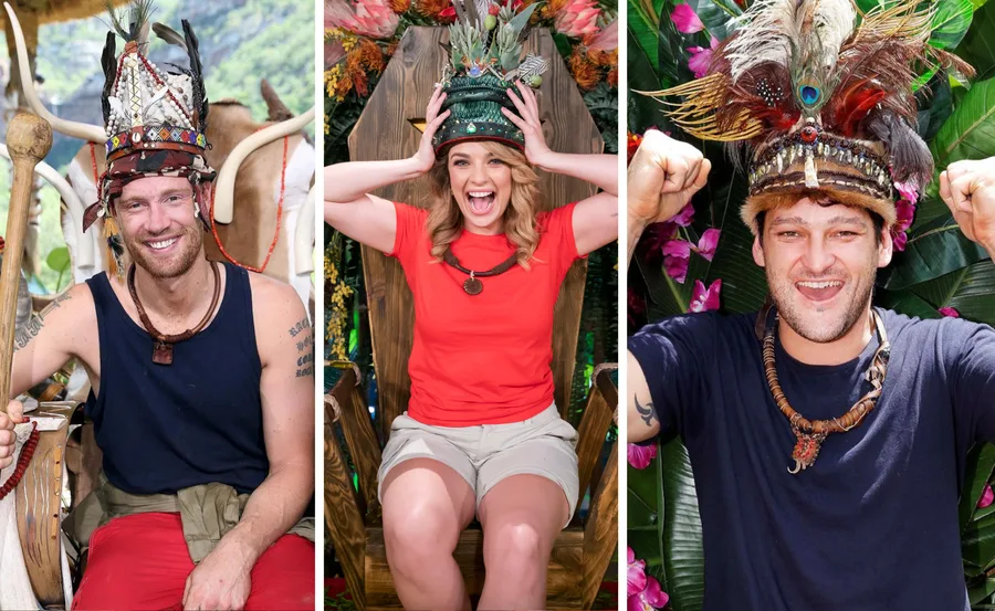 Three individuals are smiling and wearing elaborate jungle-themed crowns, celebrating in a jungle setting.
