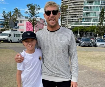 REAL LIFE: How Aussie surfing legend Mick Fanning brought some Christmas magic to one brave boy and his family