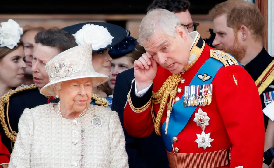 Royal family members in ceremonial attire at a public event, with ornate uniforms and decorations visible.