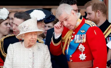 Royal family members in ceremonial attire at a public event, with ornate uniforms and decorations visible.