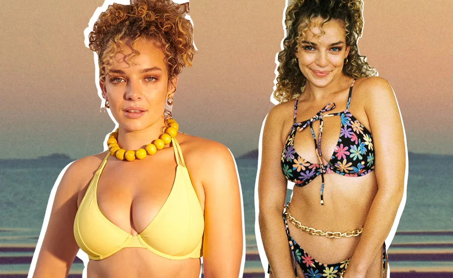 Two women with curly hair wearing bikinis; one in yellow, the other floral, against a scenic sunset background.